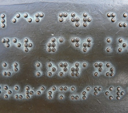 Image of braille text on metal